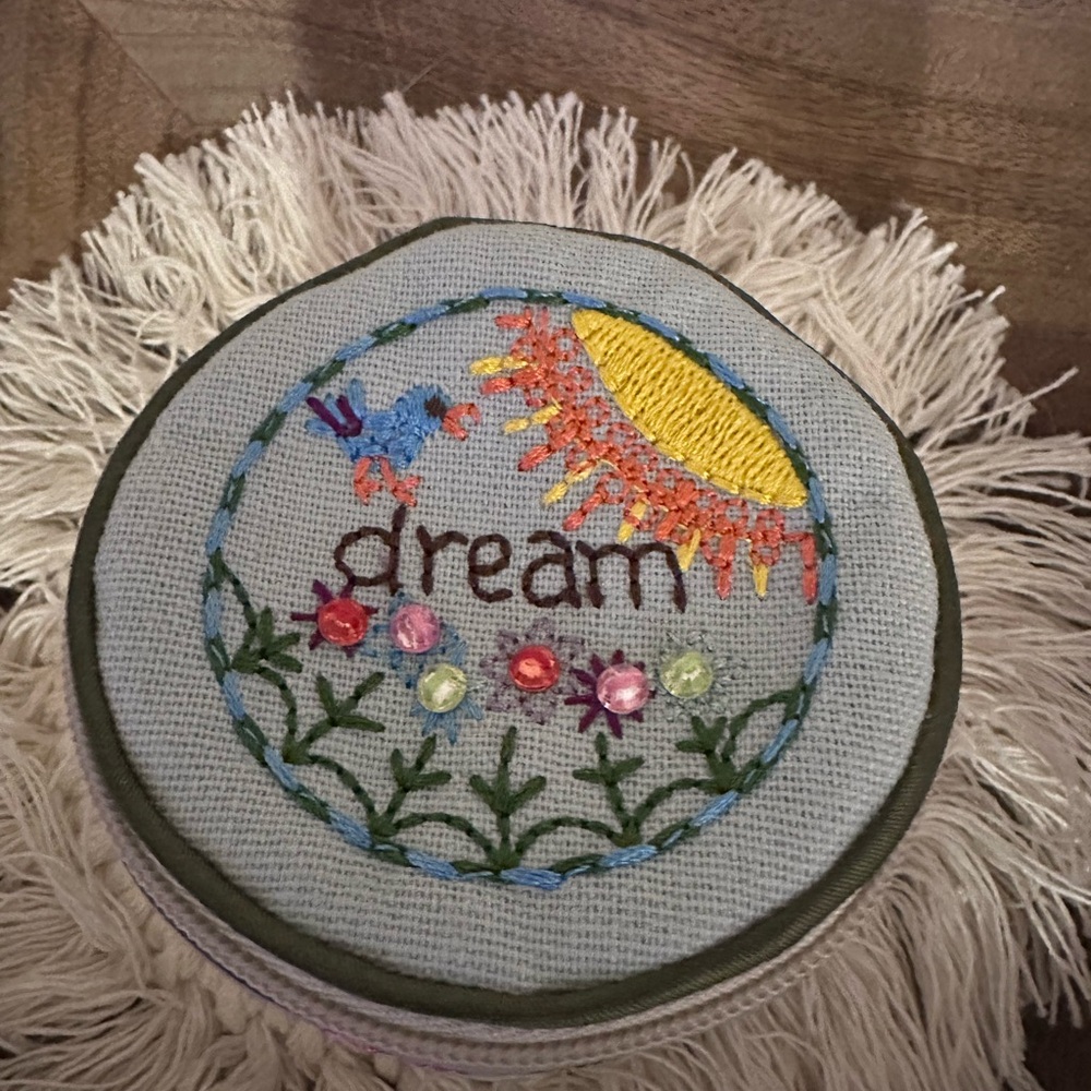 Embroidered 'Dream' Round Jewelry Pouch in Light Blue and Yellow